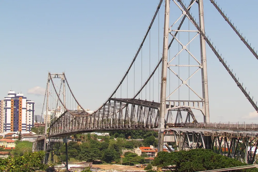 The Hercílio Luz suspension bridge in Florianópolis under a blue sky